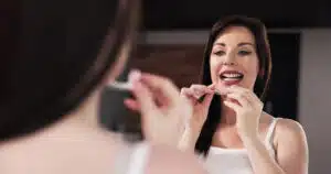 woman wearing her aligners before sleep